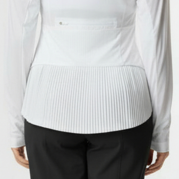 Woman wearing a white long-sleeve athletic jacket with pleats on back