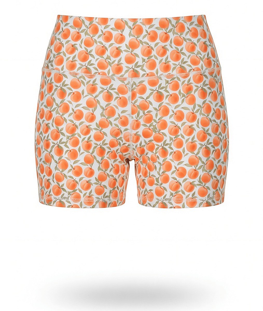NGA - No Girls Allowed high-waisted compression shorts in a peach print pattern on a white background.
