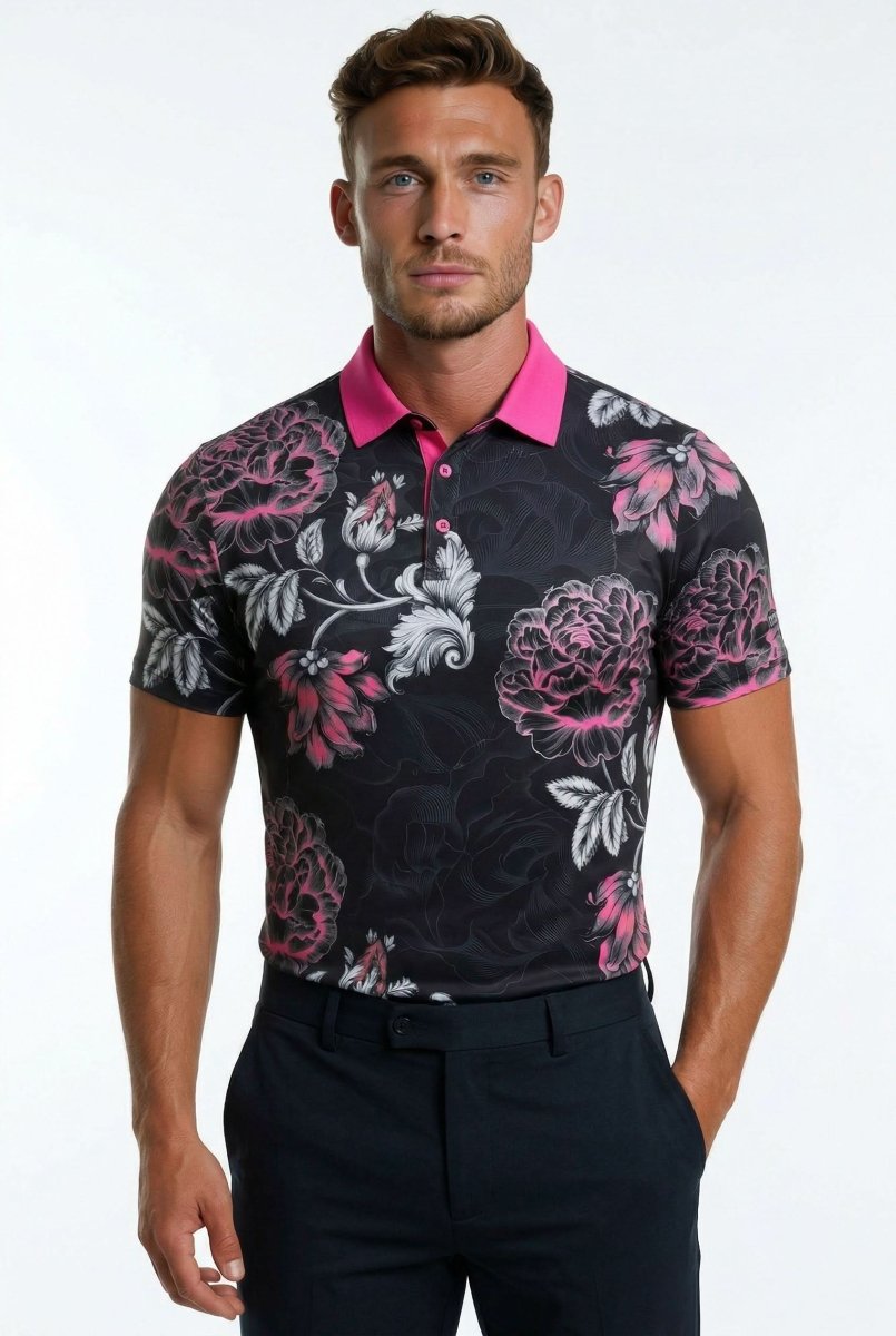 Man wearing a black floral patterned shirt with pink accents on a white background